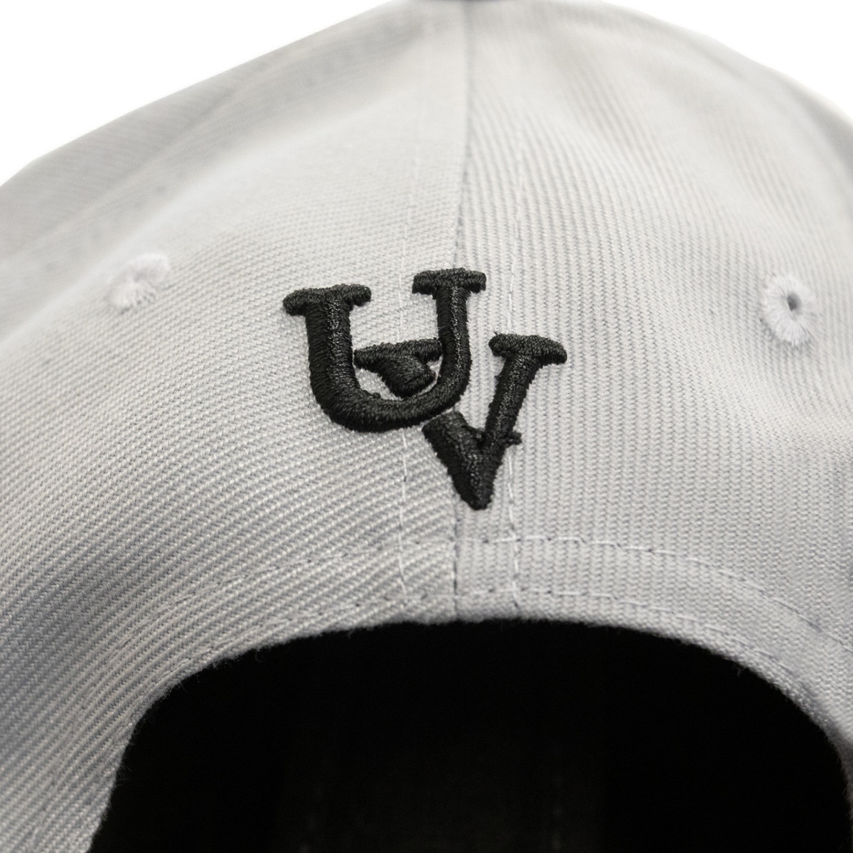 Structured adjustable grey vintage hat with black accents from the back with a retro UV logo embroidered on the back